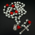 Pearl and rose rosary with decorative beads for prayer and devotion